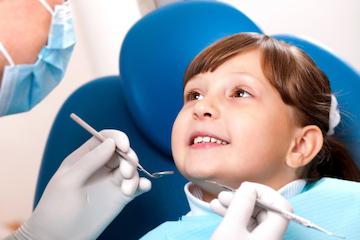 young girl getting dental exam in Arvada, CO
