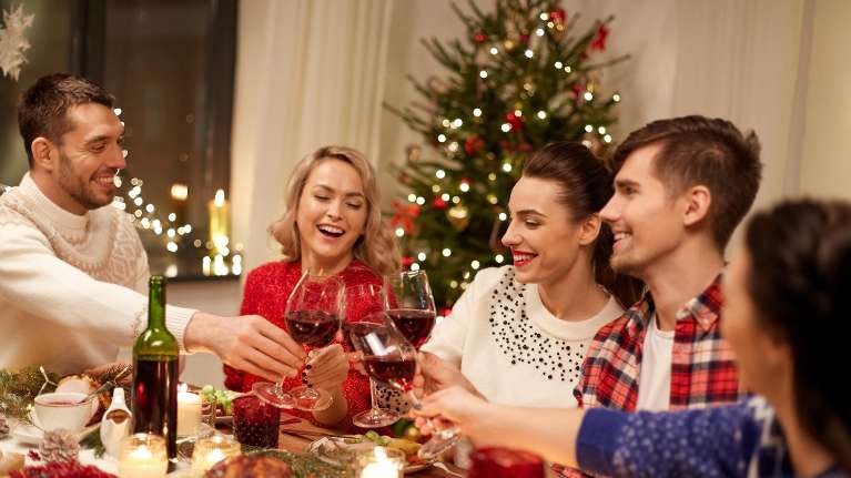 Arvada dentist | family having dinner during the holidays