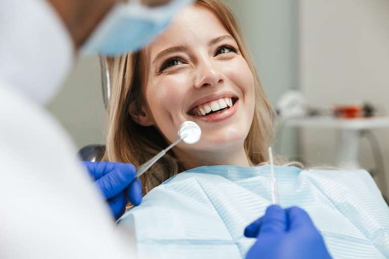 female getting dental crowns